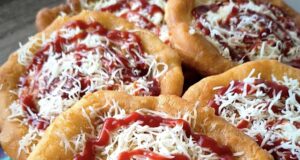 Homemade Langos from Yogurt Dough: Rise Overnight in the Fridge and Fluffy the Next Day Homemade langos from yogurt dough on a plate, topped with cheese and ketchup