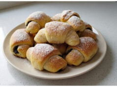 Homemade Poppy Seed Crescents: Soft Yeast Dough with a Rich Poppy Filling Homemade poppy seed crescents on a plate