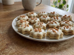 Honey Stars with Caramel Cream: Festive Cookies Dipped in White Chocolate Honey stars with caramel cream dipped in white chocolate
