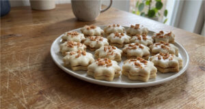 Honey Stars with Caramel Cream: Festive Cookies Dipped in White Chocolate Honey stars with caramel cream dipped in white chocolate
