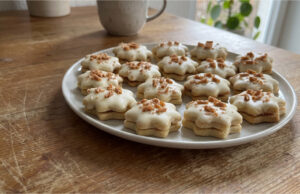 Honey Stars with Caramel Cream: Festive Cookies Dipped in White Chocolate Honey stars with caramel cream dipped in white chocolate