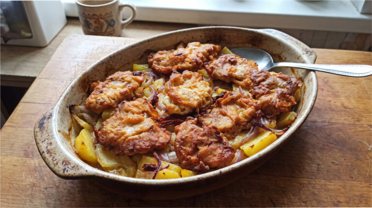 Juicy Pork Neck in Batter on Potatoes: Hearty One-Pan Meal