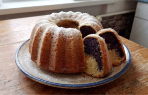 Kefir Bundt Cake with Poppy Seeds: Simple Moist Cake with a Delicate Cinnamon Layer Kefir Bundt cake with poppy seeds, sliced and served