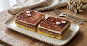 Legionnaire Slices with Jam: Traditional Nut Dessert on One Large Baking Tray Legionnaire slices with jam and nut meringue on a tray