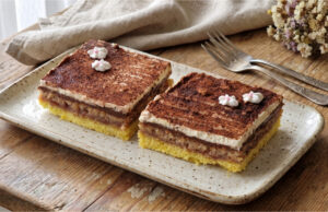 Legionnaire Slices with Jam: Traditional Nut Dessert on One Large Baking Tray Legionnaire slices with jam and nut meringue on a tray