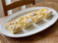 Linzer Grated Slices with Quark and Fruit: Tender Pastry and Fluffy Filling Linzer slices with quark and fruit on a tray
