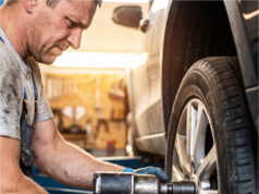At the Tire Shop, They Stripped the Thread on My Wheel Bolt and Blamed My Old Car Mechanic using a pneumatic wrench on a car wheel.