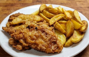Pork Cutlets in Beer Batter: Crispy Coating and Juicy Meat Inside Pork cutlets in beer batter with crispy coating and juicy meat inside
