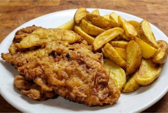 Pork Cutlets in Beer Batter: Crispy Coating and Juicy Meat Inside Pork cutlets in beer batter with crispy coating and juicy meat inside