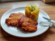 Pork Neck Meat Patties: Rested Overnight and Fried to Golden Perfection Golden pork neck meat patties with mashed potatoes and fried onions