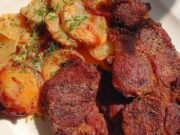 Juicy Pork Neck on Creamy Potatoes with Bacon, Onion and Baked Mozzarella Juicy pork neck with potatoes, bacon and mozzarella in a baking dish