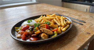 Quick Chicken Stir-Fry with Vegetables: Fast Lunch with Crispy Oven Fries Quick chicken stir-fry with vegetables and crispy oven fries