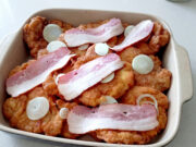 Reverse Schnitzels from Pork or Chicken: Crispy, Juicy, and Oven-Baked Reverse schnitzels with bacon and onion on a tray