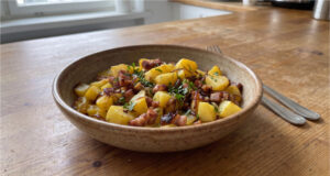 Roasted Potatoes with Bacon: An Easy One-Pan Lunch Roasted potatoes with bacon in a baking dish