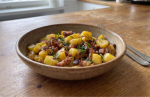 Roasted Potatoes with Bacon: An Easy One-Pan Lunch Roasted potatoes with bacon in a baking dish