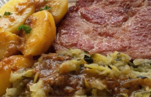 Roasted Smoked Pork Neck with Zucchini Cabbage: A Hearty Sunday Lunch Roasted smoked pork neck with boiled potatoes and zucchini cabbage in Moravian style