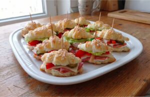 Savory Mini Puff Pastry Croissants: Quick Party Bites with Your Favorite Filling Variety of savory mini puff pastry croissants with different fillings on a serving tray
