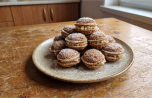 Stuffed Walnuts with Delicate Cream: Tender Christmas Cookies That Soften Beautifully Stuffed walnut cookies with delicate cream on a festive plate