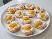 Twisted Buns with Custard and Fruit: Fluffy Yeast Dough for Festive Treats Twisted buns with custard and fruit on a tray