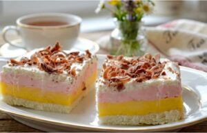 Creamy Tricolor Dessert: Recipe for a Three-Colored Delight with Meringue Base, Double Cream, and Whipped Cream Tricolor slices with vanilla and raspberry cream – festive dessert from egg whites