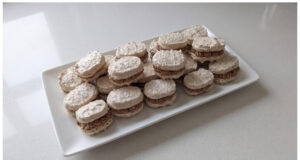 Homemade Walnut Meringue Shells: Delicate Snowy Shells with Smooth Parisian Cream Homemade walnut meringue shells with Parisian cream on a plate