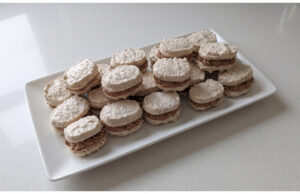 Homemade Walnut Meringue Shells: Delicate Snowy Shells with Smooth Parisian Cream Homemade walnut meringue shells with Parisian cream on a plate