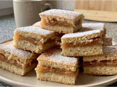 Apple Slices with Cinnamon: Simple Layered Dough with Moist Fruit Filling Apple slices with cinnamon on a tray