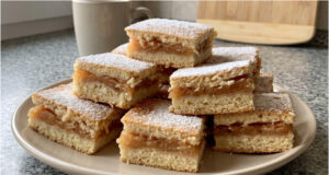Apple Slices with Cinnamon: Simple Layered Dough with Moist Fruit Filling Apple slices with cinnamon on a tray