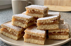 Apple Slices with Cinnamon: Simple Layered Dough with Moist Fruit Filling Apple slices with cinnamon on a tray