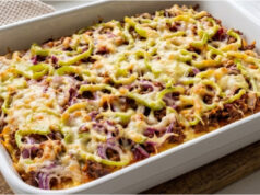 Baked Potato Pancake Without Frying: Crispy Treat for the Whole Family Baked potato pancake with cheese and vegetables on a tray