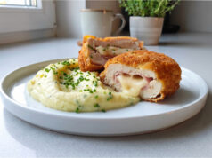 Chicken Cordon Bleu: Juicy Meat with Ham, Emmental and a Crispy Crust Chicken Cordon Bleu served with fries and salad