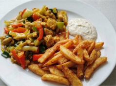 Chicken Stir-Fry with Homemade Fries: Juicy Meat, Crunchy Vegetables, and Golden Sides Chicken stir-fry with homemade fries, juicy meat, crunchy vegetables, and golden side dish