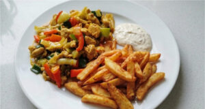 Chicken Stir-Fry with Homemade Fries: Juicy Meat, Crunchy Vegetables, and Golden Sides Chicken stir-fry with homemade fries, juicy meat, crunchy vegetables, and golden side dish