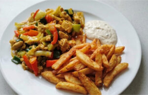 Chicken Stir-Fry with Homemade Fries: Juicy Meat, Crunchy Vegetables, and Golden Sides Chicken stir-fry with homemade fries, juicy meat, crunchy vegetables, and golden side dish