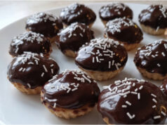 Cups Inspired by Drunken Isidor: Nut Filling, Cocoa Cream, and Chocolate Glaze Cups inspired by Drunken Isidor with nut filling, cocoa cream, and chocolate glaze