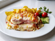 Farmer’s Layered Pork Chops: Juicy Meat with Bacon, Vegetables, and Golden Cheese Farmer's layered pork chops with bacon, vegetables, and melted cheese
