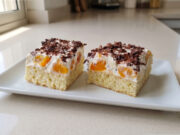 Homemade Florida Slices with Peaches: Moist Sponge, Delicate Cream, and Fluffy Whipped Cream Florida slices with peaches and whipped cream