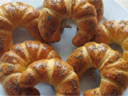 Homemade Buttery Crescent Rolls with Poppy Seeds: Fluffy Pastries with a Delicate Rum Aroma Homemade buttery crescent rolls with poppy seeds, fluffy like from a bakery