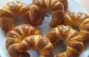 Homemade Buttery Crescent Rolls with Poppy Seeds: Fluffy Pastries with a Delicate Rum Aroma Homemade buttery crescent rolls with poppy seeds, fluffy like from a bakery