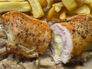 Chicken Pocket with Ham and Brie: Juicy Meat on a Creamy Mushroom Bed Juicy chicken pocket stuffed with ham and Brie cheese on a creamy mushroom bed with steak fries