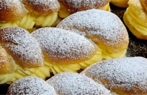 Luxurious Pudding Twists: Fluffy Yeast Pastries with Delicate Vanilla Cream Luxurious pudding twists with vanilla cream on a plate