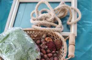 Create a Magical Autumn Decoration: Anyone Can Make a Glowing Tree from Chestnuts and Acorns All materials for making a glowing autumn tree: chestnuts, acorns, moss, twine, and frame
