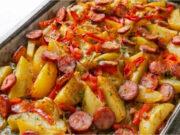 One-Pan Potatoes with Sausage: Simple Dinner with Vegetables and Aromatic Herbs One-pan potatoes with sausage, vegetables, and aromatic herbs