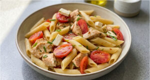 Pasta Salad with Chicken: Juicy Tomatoes, Salty Cheese and a Simple Dressing Pasta salad with chicken, juicy tomatoes, salty cheese and a simple dressing
