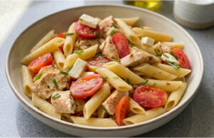 Pasta Salad with Chicken: Juicy Tomatoes, Salty Cheese and a Simple Dressing Pasta salad with chicken, juicy tomatoes, salty cheese and a simple dressing
