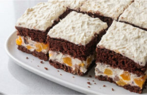 Peach Cake with Chocolate: Fluffy Cocoa Sponge with Delicate Mascarpone Cream Peach cake with chocolate: fluffy cocoa sponge with delicate mascarpone cream