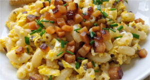 Lightning-fast Pasta Skillet with Bacon: Hearty One-Pan Egg Dinner Quick pasta skillet with bacon, eggs, and chives served on a plate