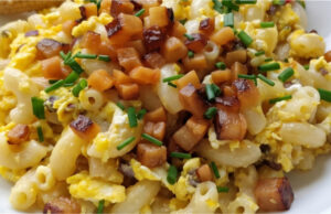 Lightning-fast Pasta Skillet with Bacon: Hearty One-Pan Egg Dinner Quick pasta skillet with bacon, eggs, and chives served on a plate