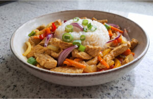 Quick Pork Stir-Fry: Juicy Lunch with Vegetables and Fluffy Rice Quick pork stir-fry with vegetables and fluffy rice