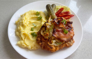Reverse Pork Neck Schnitzels: Juicy Meat Baked with Onions and Bacon Reverse pork neck schnitzels baked with onion and bacon